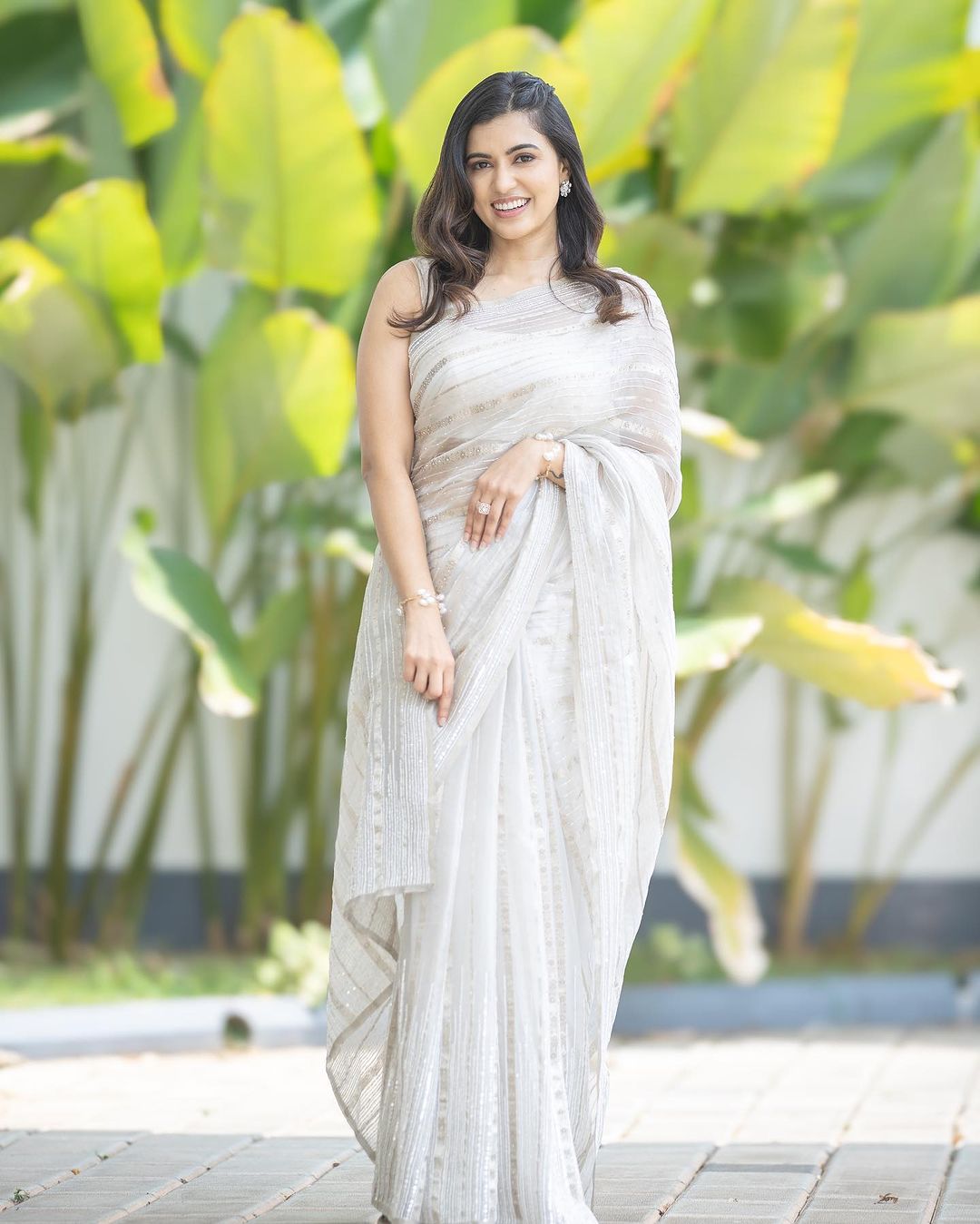 Tamil Actress Anju Kurian Stills in Sleeveless White Saree